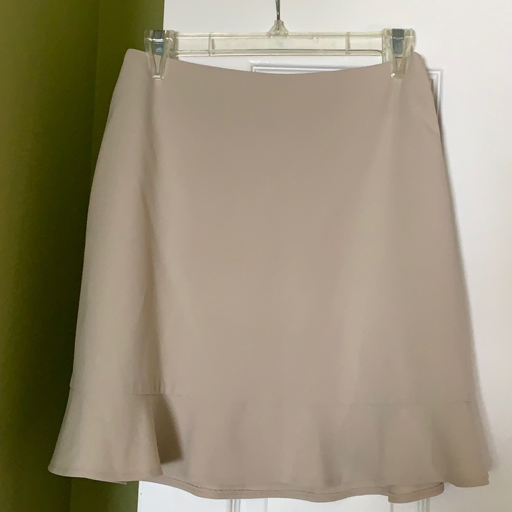 Knee high skirt khaki slight ruffle. 62% polyester 34% rayon 4% lycra spandex
